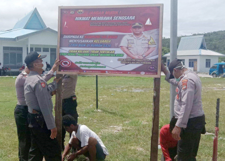 POLSEK KEI BESAR SOSIALISASI COVID-19.